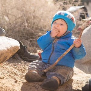 Baby sitting in the dirt