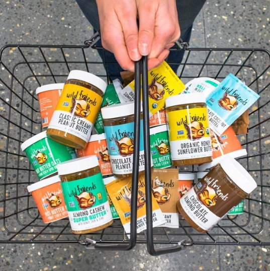 Nut butters and treats in a shopping basket