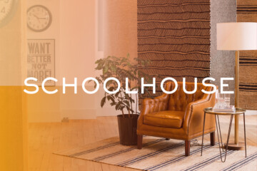 Schoolhouse logo on image of styled living room