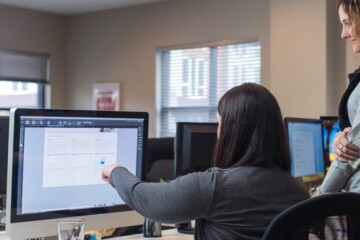 Two women working on a desktop