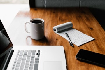 computer and coffee at desk