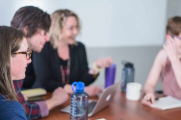 Group of people talking in office