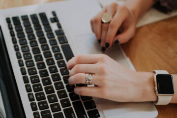 person typing on a laptop