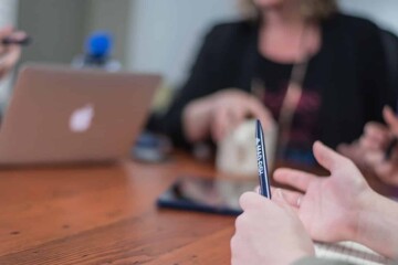 People talking around a board room table