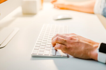 Person typing on computer