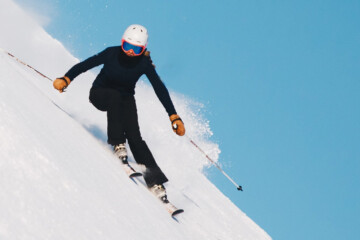 person skiing down a slope