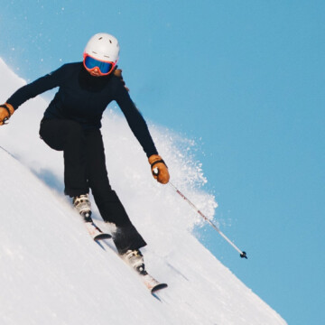 person skiing down a slope