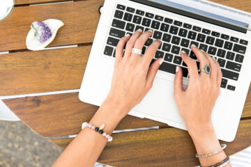 woman typing on a laptop