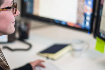 Woman working on paid media strategy