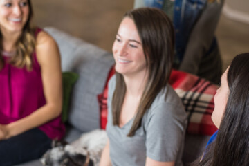 People laughing and talking in an office in Portland Oregon