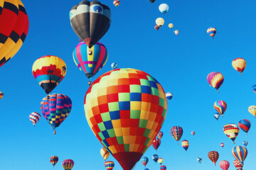 colorful hot air balloons against blue sky