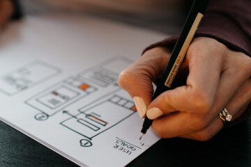 woman drawing a design plan